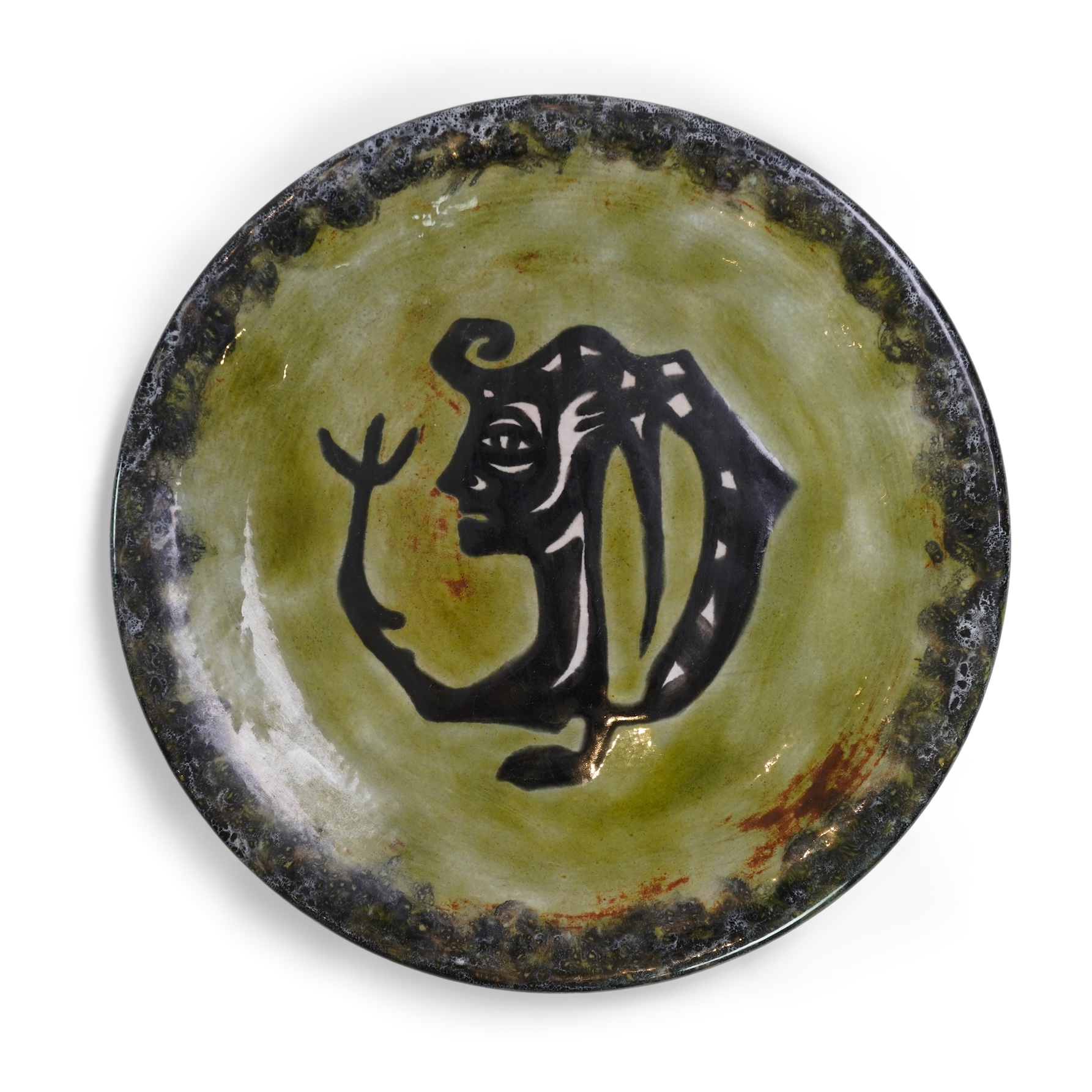 Jean Lurçat (1892-1966): A green glazed earthenware plate, decorated with a stylised central figure